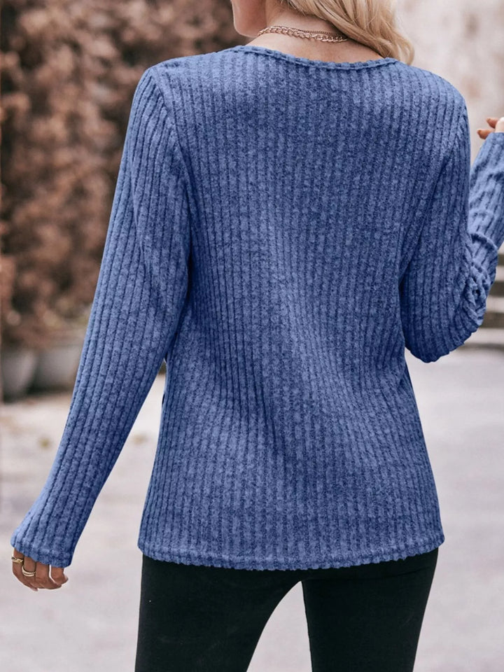 Ribbed knit long sleeve top with side button hem