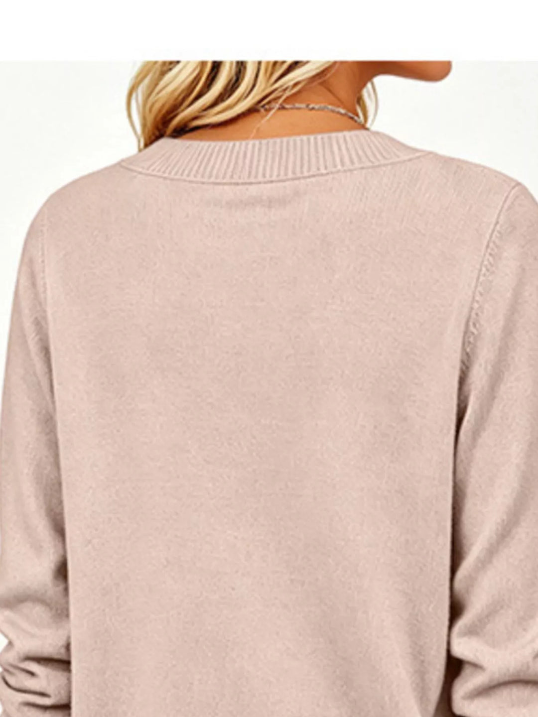 V-neck long sleeve sweater with button cuffs and side slits