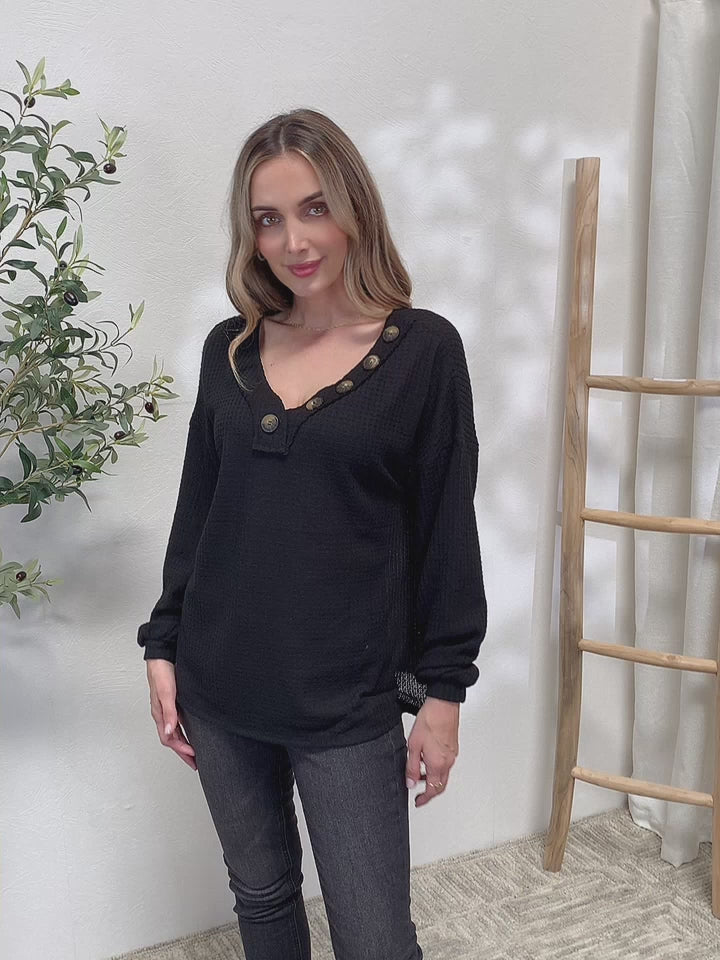 Waffle-knit henley blouse with V-neck and long sleeves