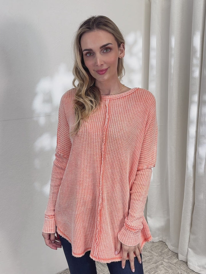 Oversized waffle knit long sleeve top with exposed seams
