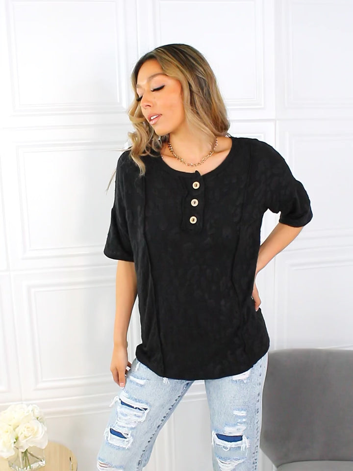 Textured leopard short sleeve top with button placket